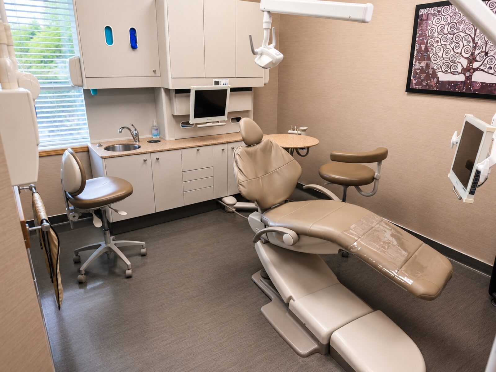 Bright, modern dental treatment room with patient chair