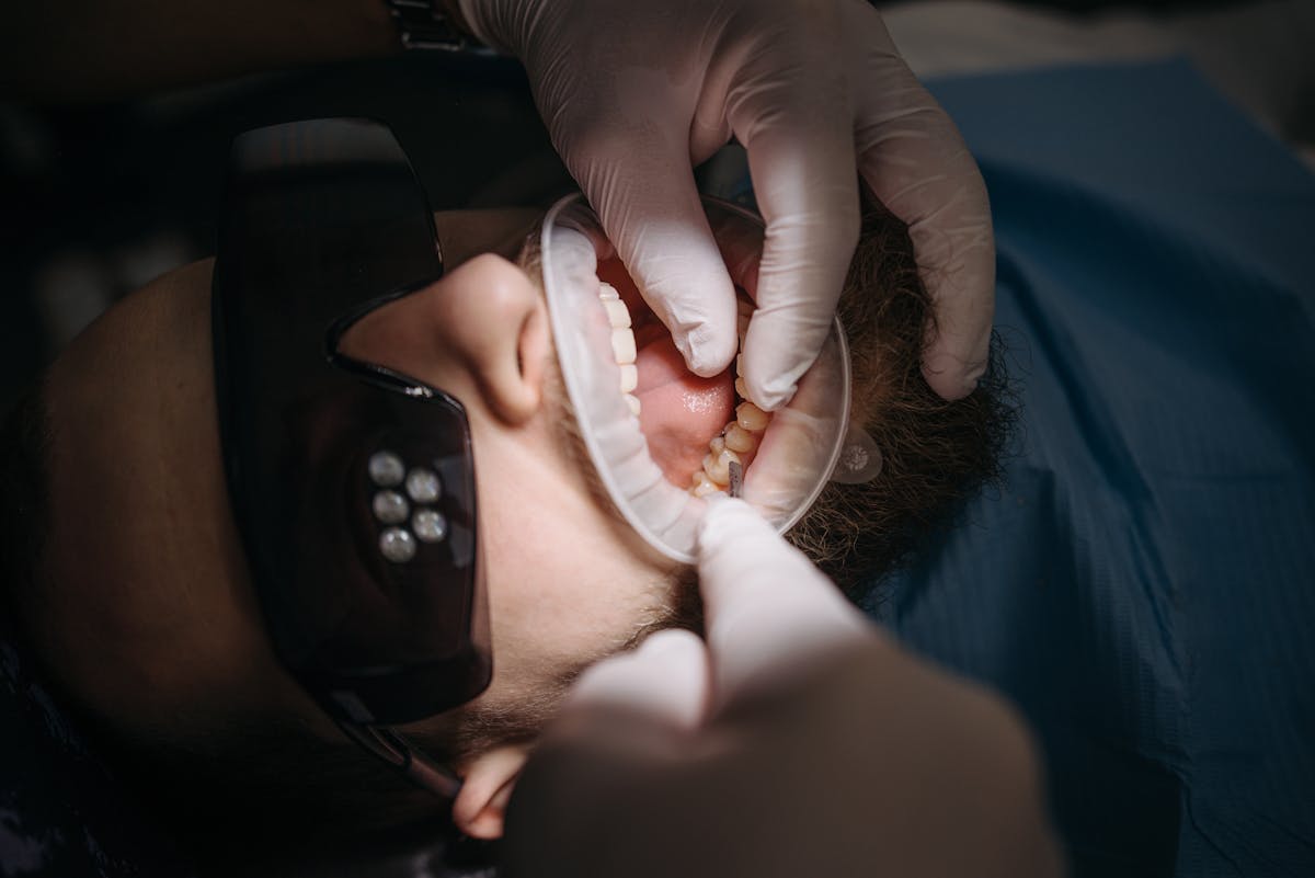 Dentist checking how a patient's upper and lower teeth meet